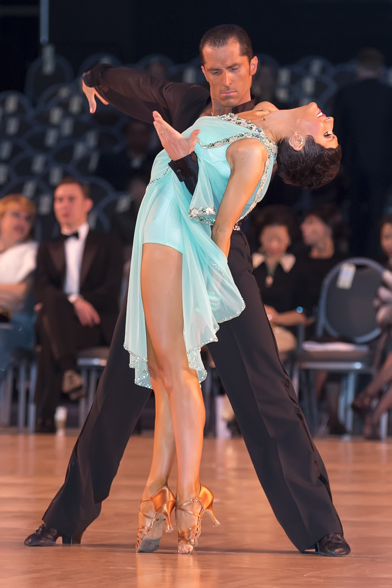 Bree Watson performing in turquoise ballroom gown